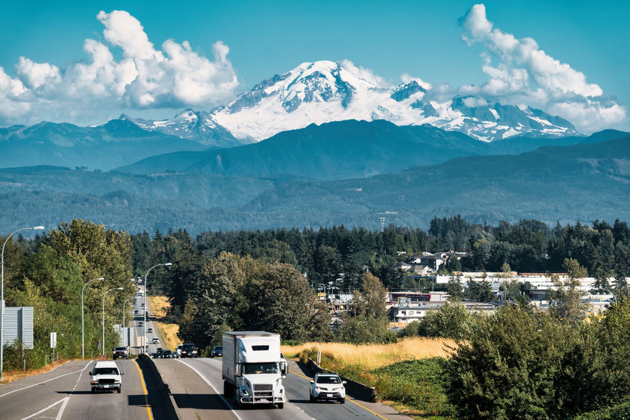 Highway through the Abbotsford-Mission area of British Columbia, with mountains in the background