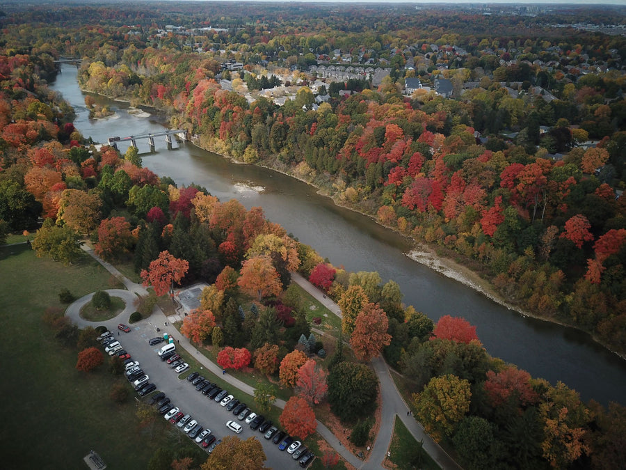 Aerial view of the Thames River surrounded by fall colours in London, Ontario