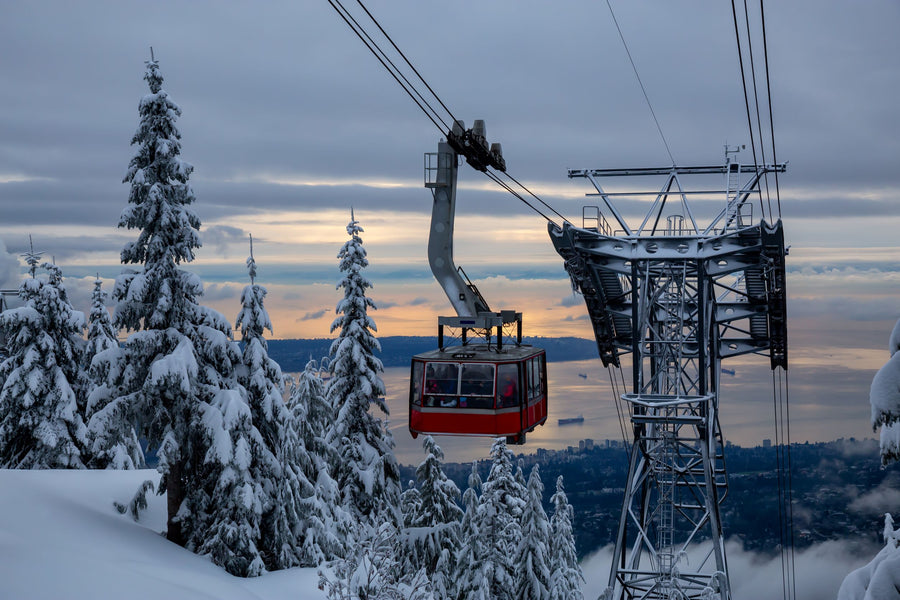 Grouse Mountain Skyride above snow-covered forest in North Vancouver, British Columbia