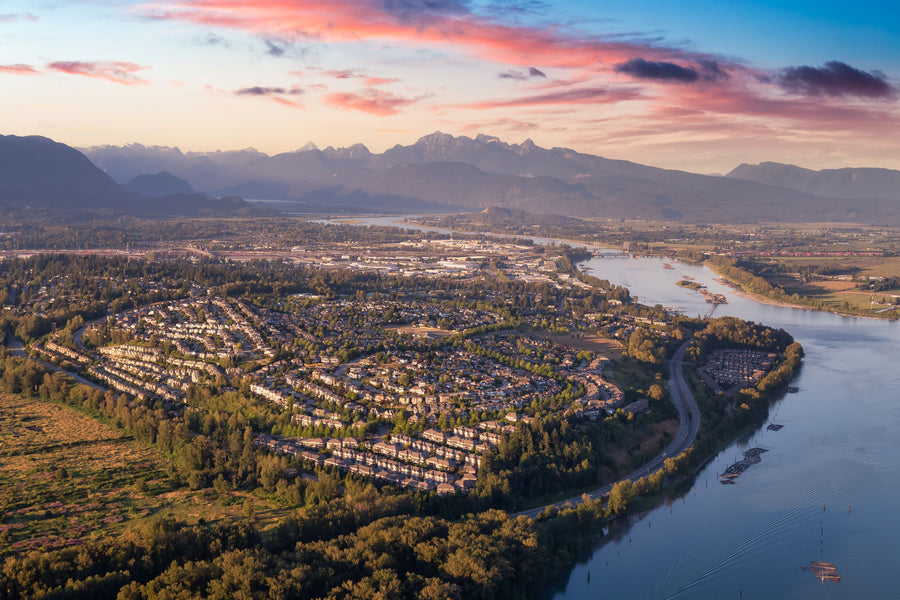 Aerial view of Port Coquitlam along the Pitt River with the Coast Mountains in the background